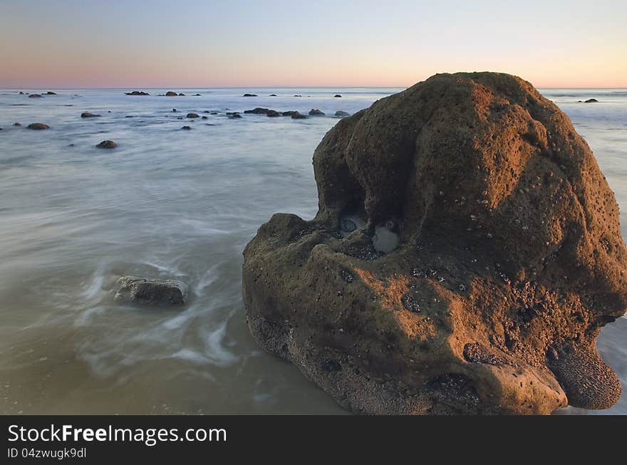 Exposure of a coastal tide surging through a cove. Exposure of a coastal tide surging through a cove.