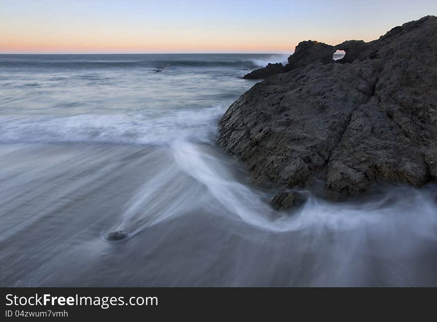 Exposure of a coastal tide surging through a cove. Exposure of a coastal tide surging through a cove.