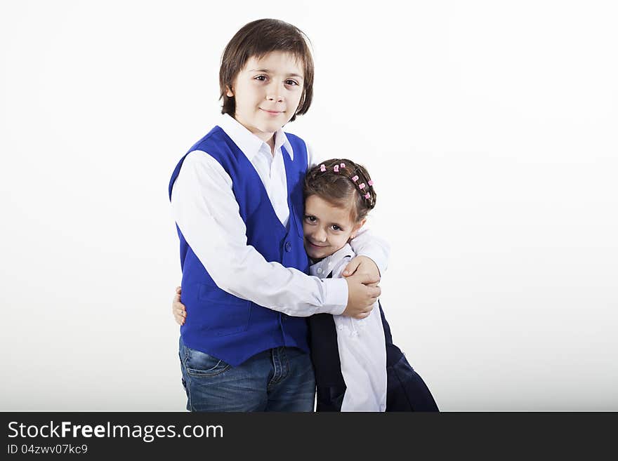 School boy and girl posing together. School boy and girl posing together