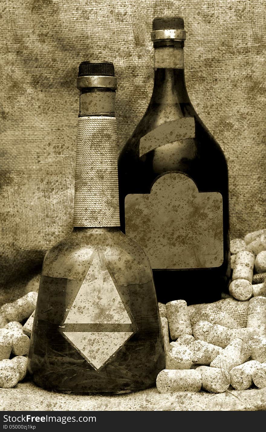 old bottles on jute cloth with corks grunge background. old bottles on jute cloth with corks grunge background