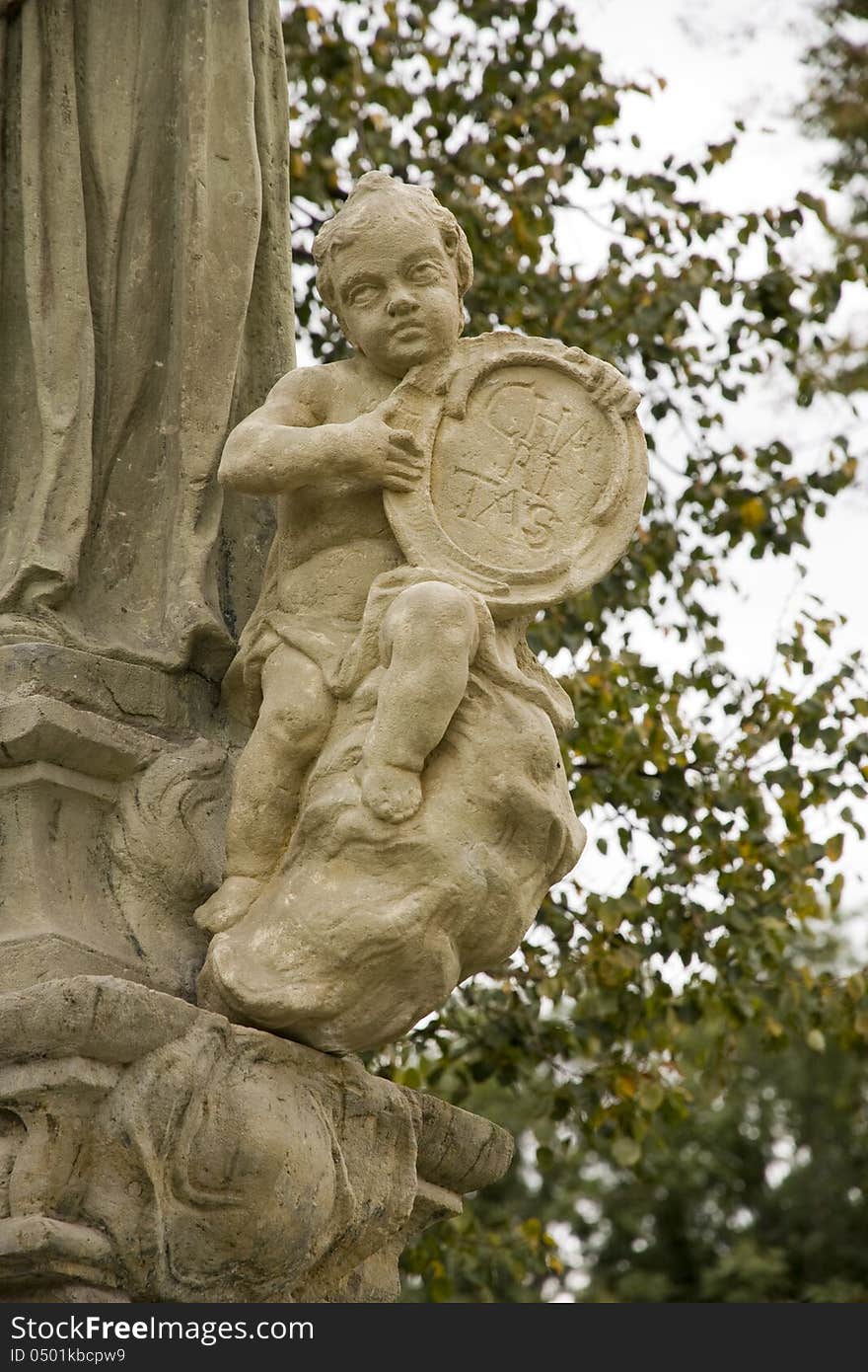 Detail of the statue of the young child. Detail of the statue of the young child