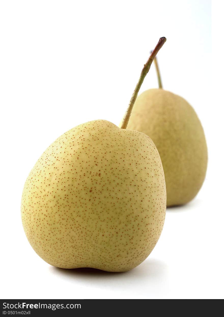 Closeup(macro) photo of two fully ripe, juicy organic pears on white background. Closeup(macro) photo of two fully ripe, juicy organic pears on white background