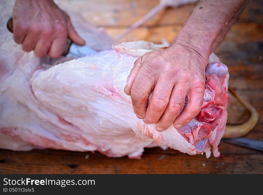 Pork cutted by a butcher on a wooden table