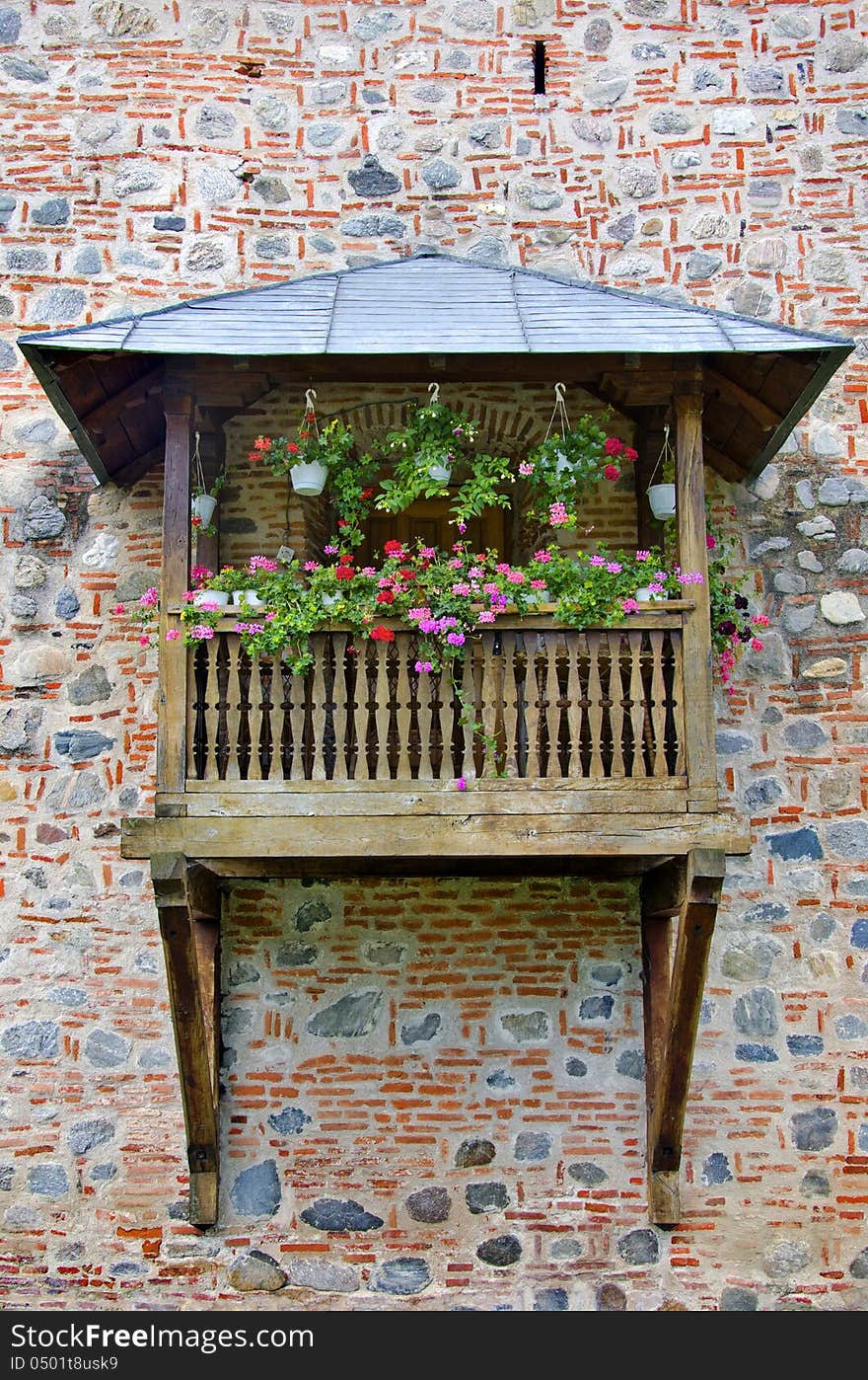 Balcony decorated with pink and red flowers