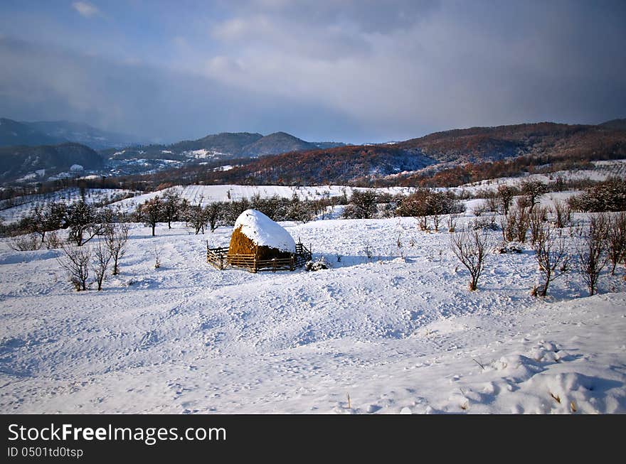 Snow covered haycock