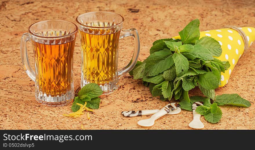 Delicious mint tea with citron, on a cork table