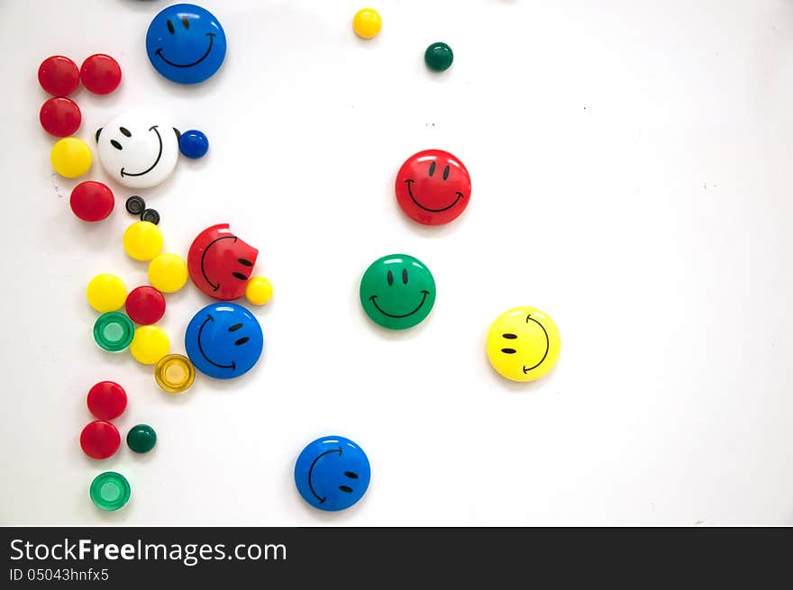 Many colourful smiling faces magnet