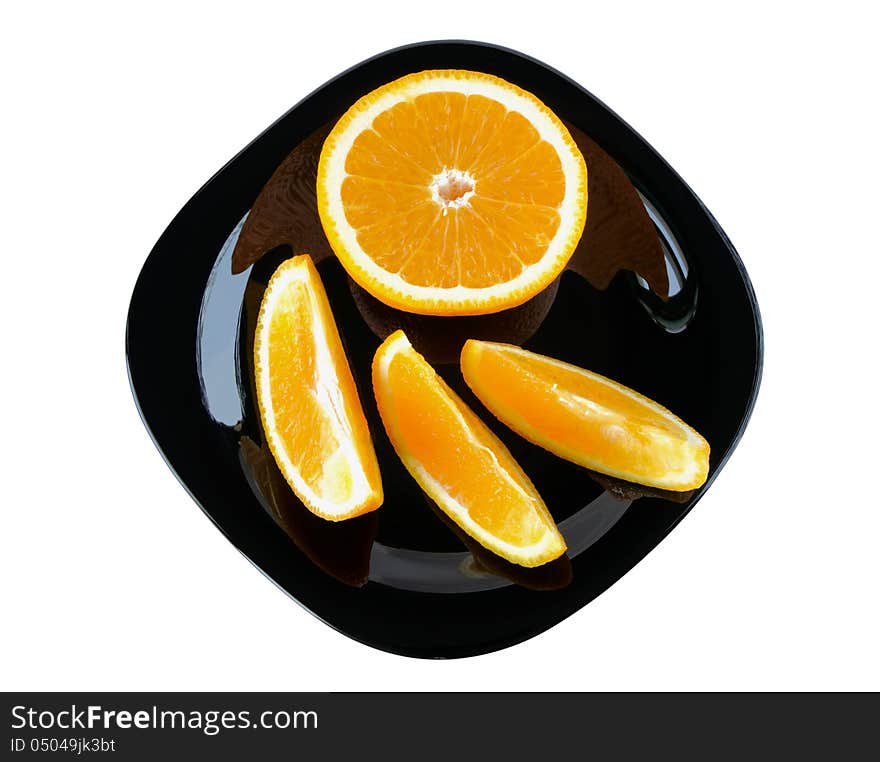 Slices of orange on a plate on white background. Slices of orange on a plate on white background