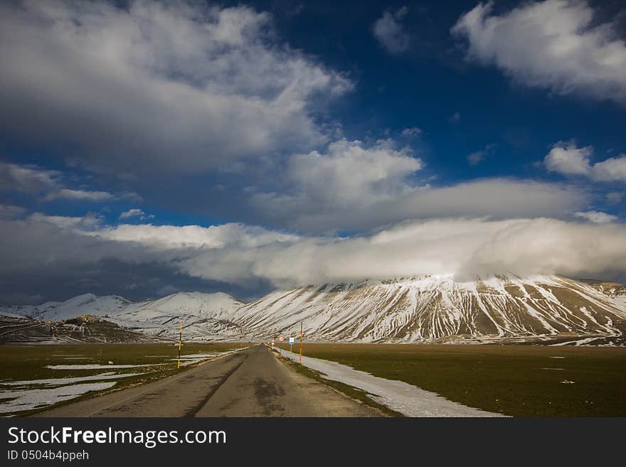 Mountain road panorama captured in Castelluccio di Norcia. Mountain road panorama captured in Castelluccio di Norcia