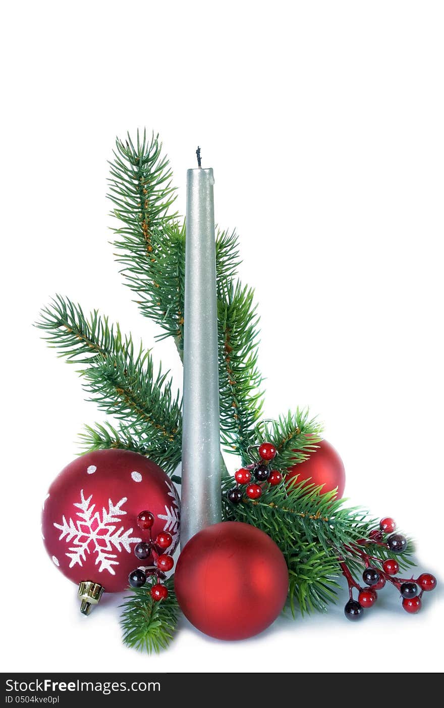 Vertical christmas composition with a silver candle