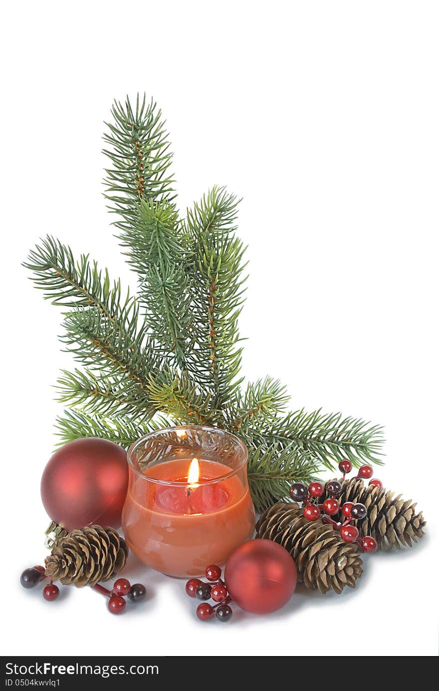 Vertical christmas composition with a burning candle