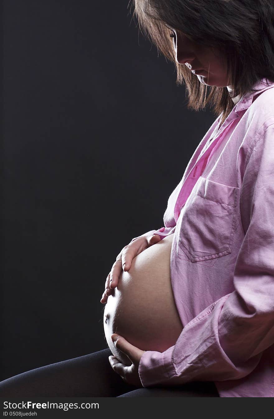 Beautiful pregnant woman playing with balloons