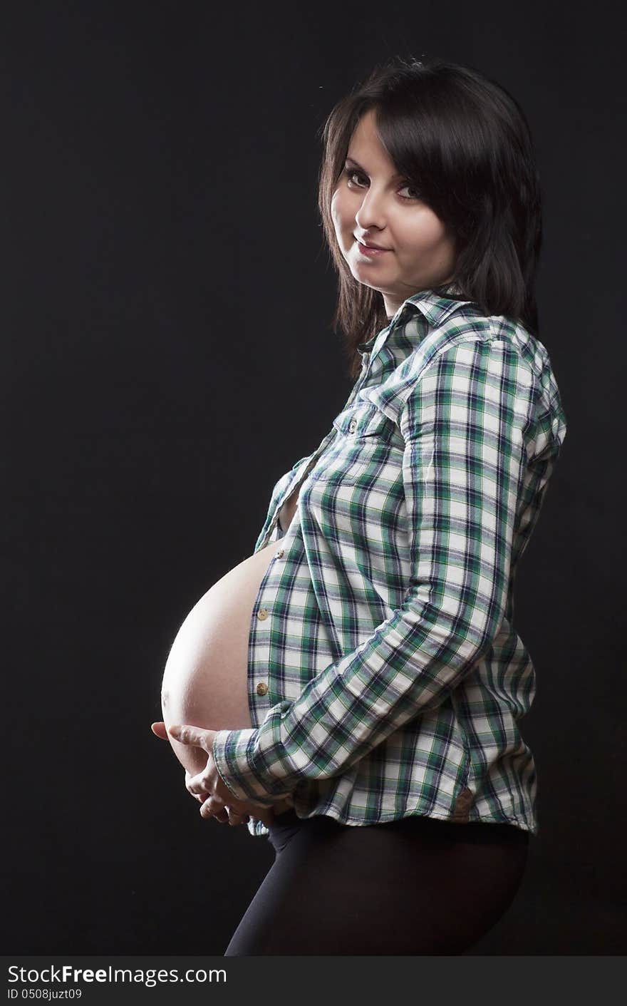 Beautiful pregnant woman playing with balloons