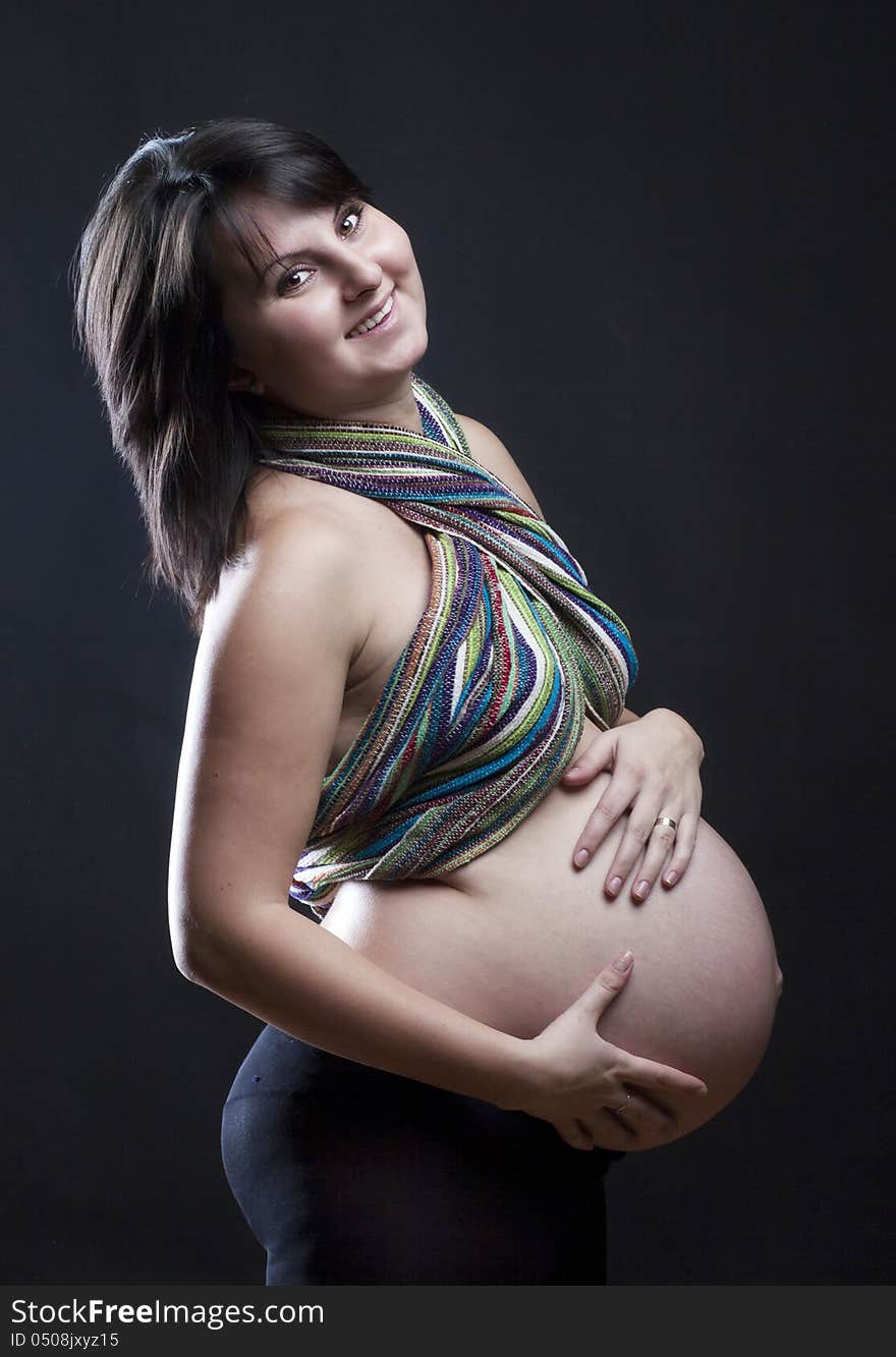 Beautiful pregnant woman playing with balloons