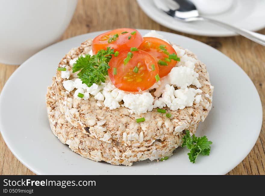 Bread with cottage cheese, cherry tomatoes for breakfast closeup