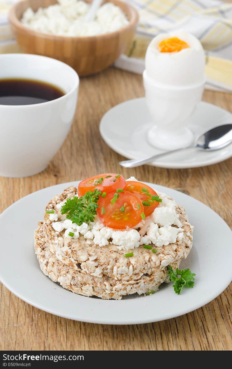 Bread with cottage cheese, cherry tomatoes, boiled egg and coffee