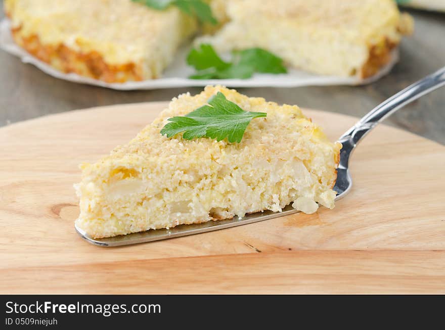 Piece of tart with cabbage and cheese closeup