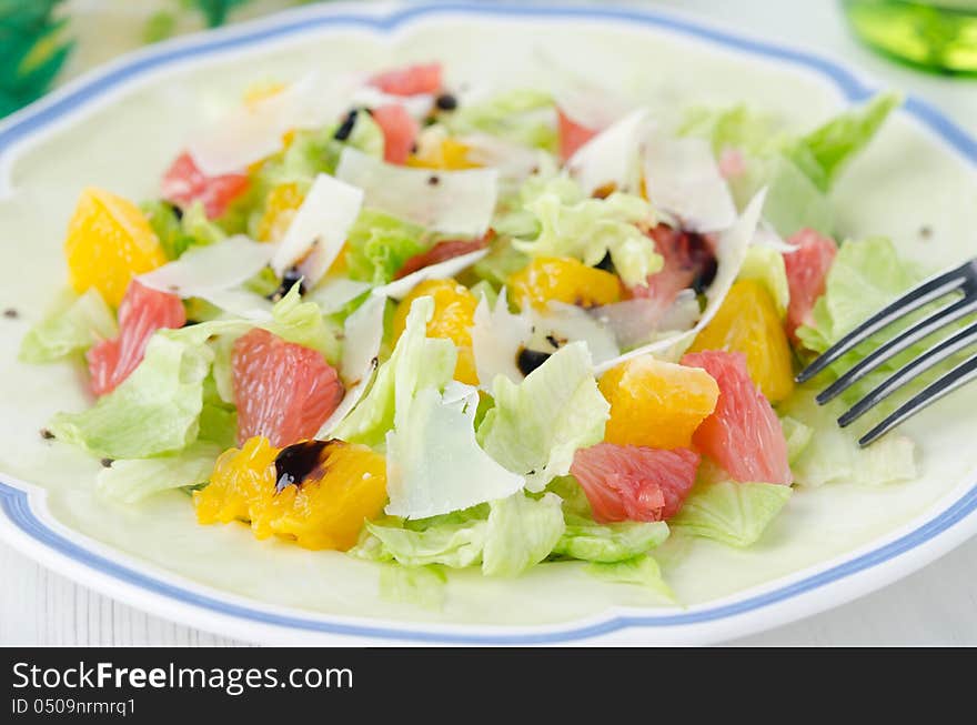 Salad With Grapefruit, Oranges, Iceberg Lettuce And Grated Chees