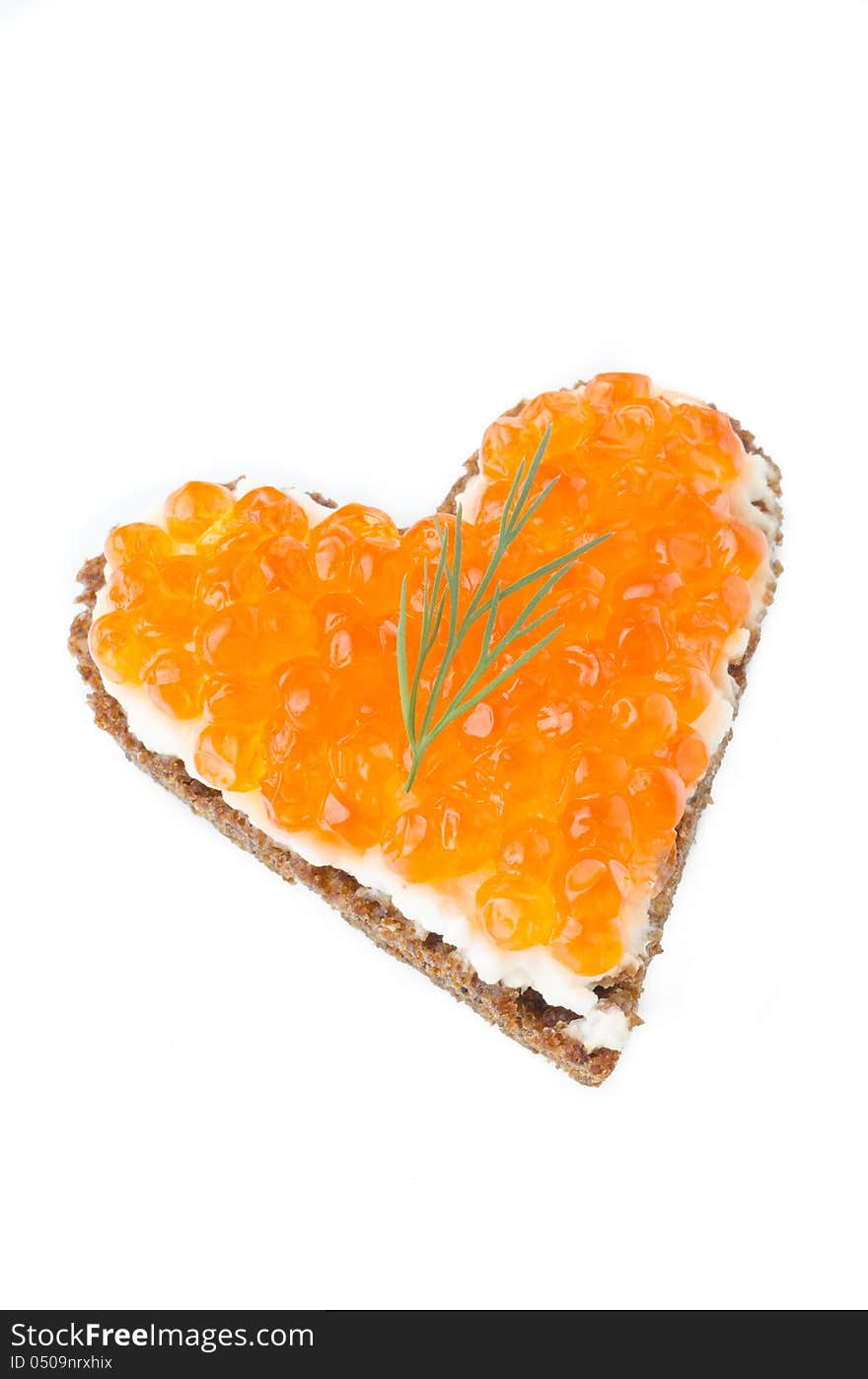 Sandwich with red caviar in the form of a heart  isolated