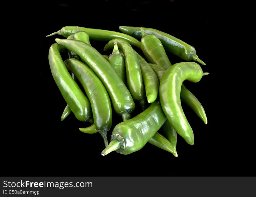 Green hot  pepper chili over black background. Green hot  pepper chili over black background