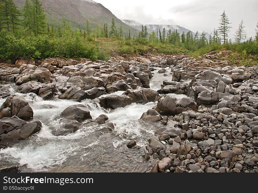 Roaring waterfalls on the river dug canyon