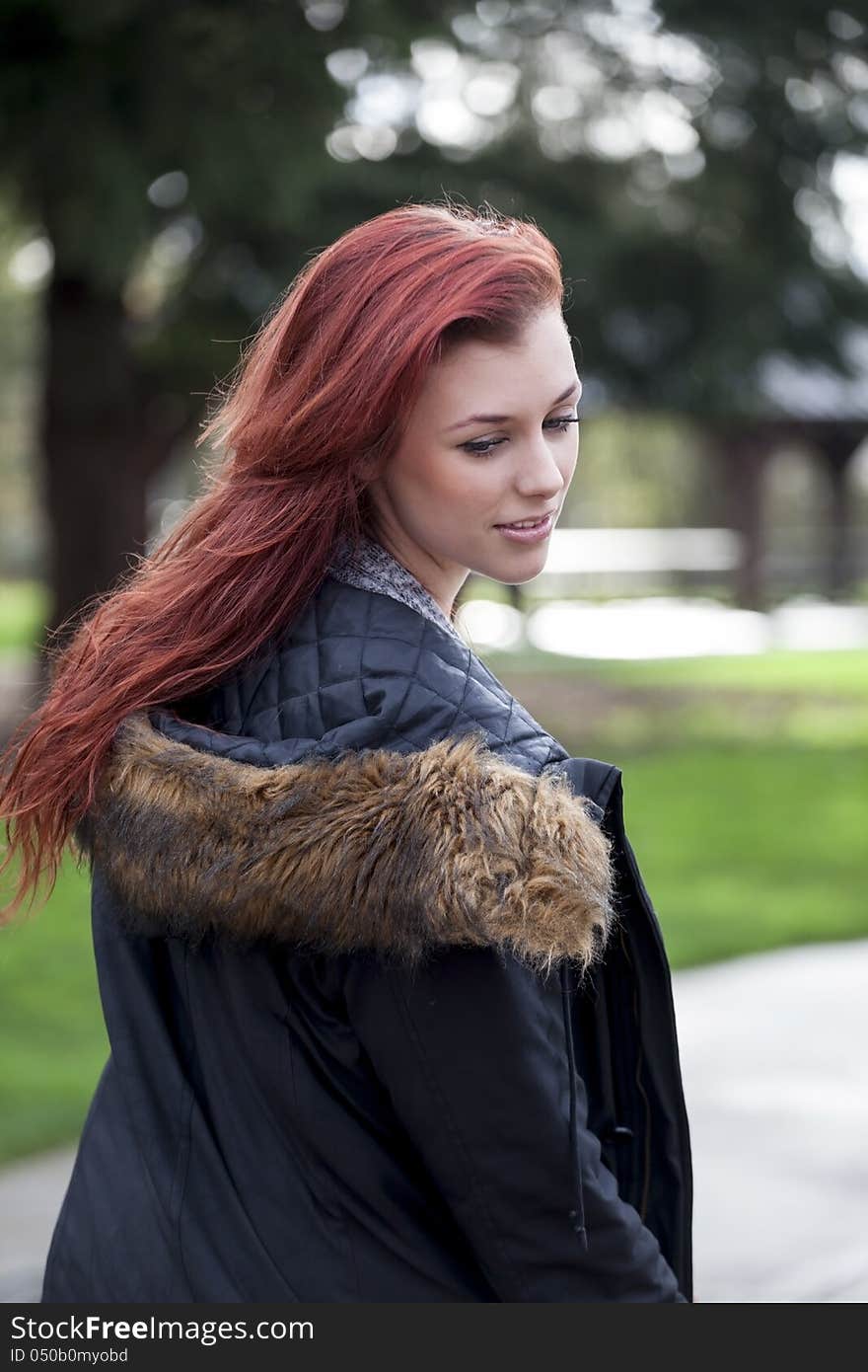 Young woman staring looking back over her shoulder. Young woman staring looking back over her shoulder.