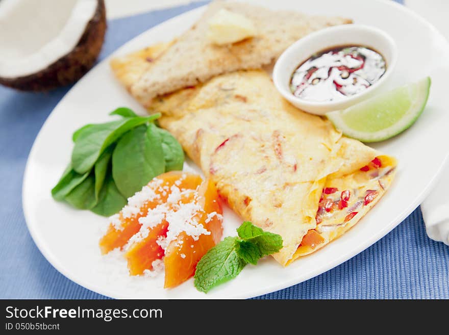 Healthy omelette with chillies, coriander, paw paw, spinach lime and spicy soy sauce. Healthy omelette with chillies, coriander, paw paw, spinach lime and spicy soy sauce