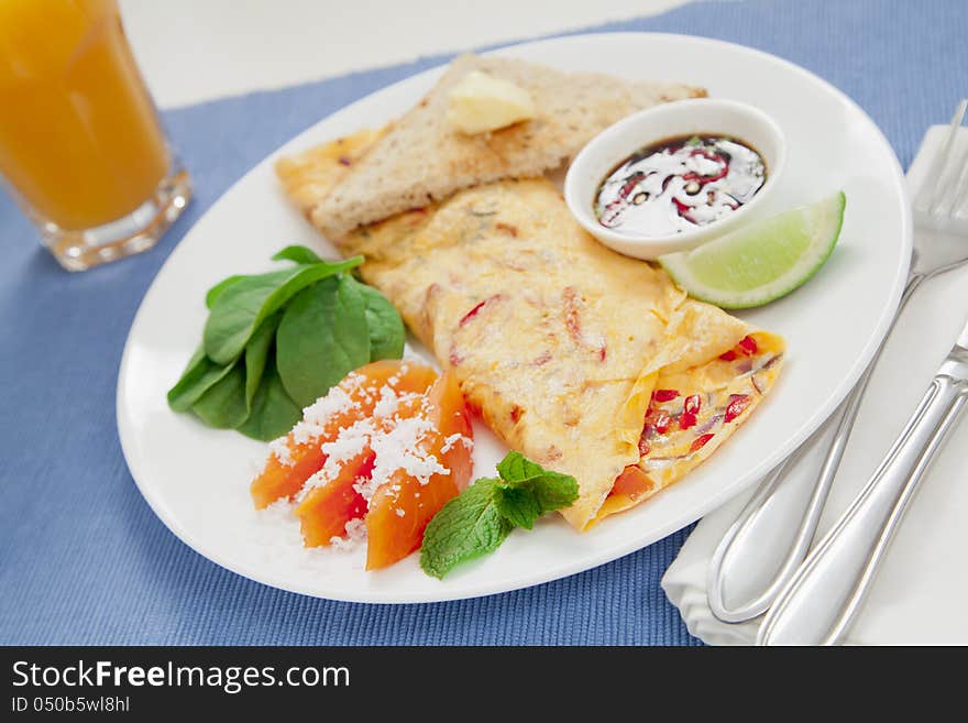 Healthy omelette with chillies, coriander, paw paw, spinach lime and spicy soy sauce. Healthy omelette with chillies, coriander, paw paw, spinach lime and spicy soy sauce