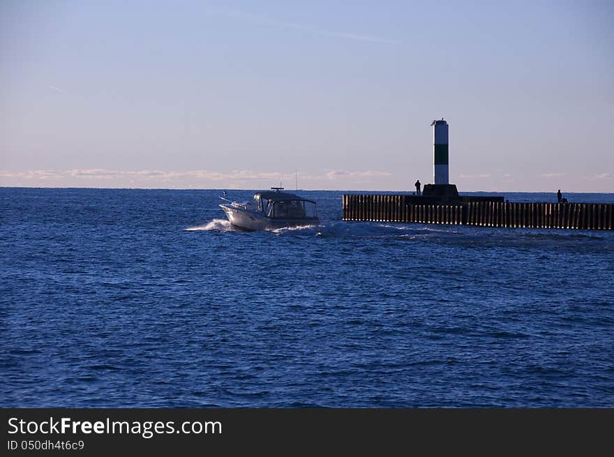 Boat Passing lighthouse