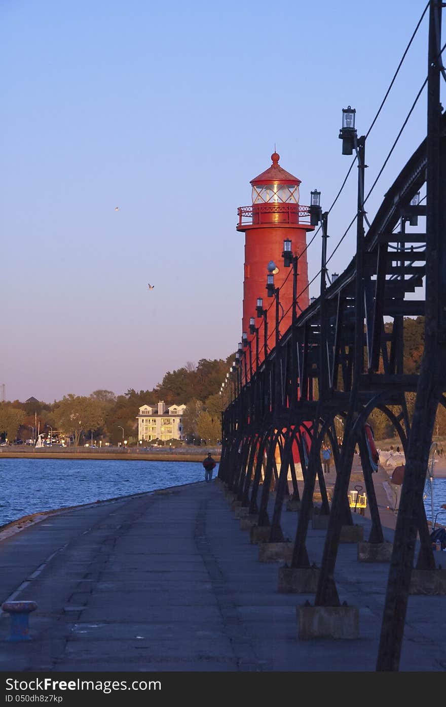 Lighthouse on lakeshore with elevated power supply. Lighthouse on lakeshore with elevated power supply