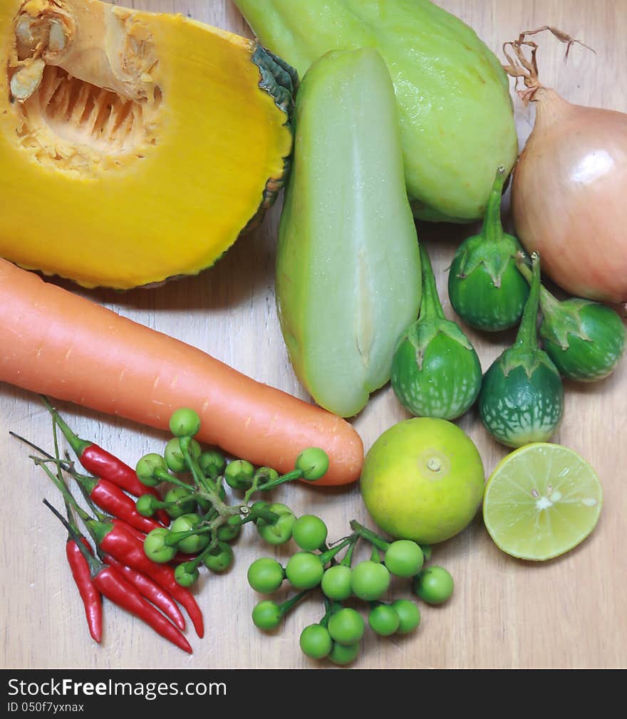 Still life with variety of vegetables on wood background