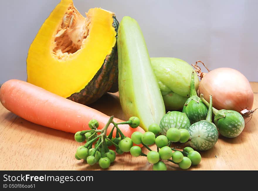 Still life with variety of vegetables on wood background