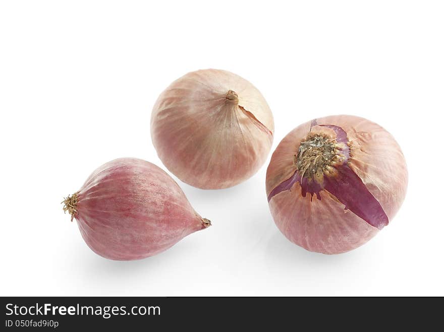 Group of small red shallot on white background