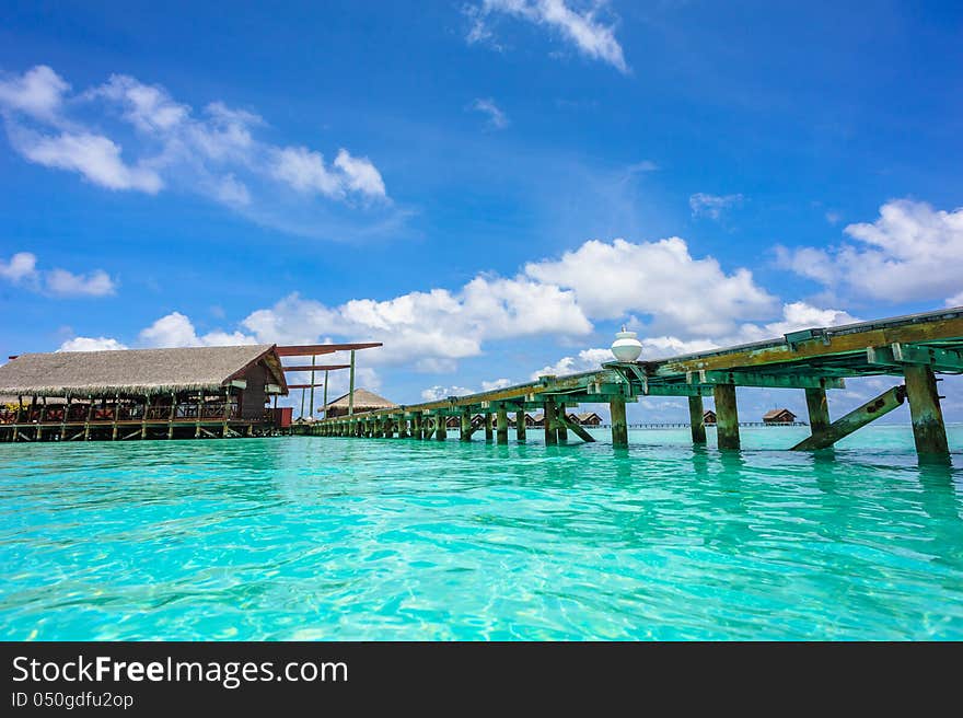 Wooden Path To The Bungalow Above Water