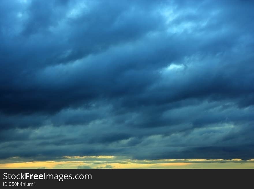 The dark Storm clouds over horizon. The dark Storm clouds over horizon.