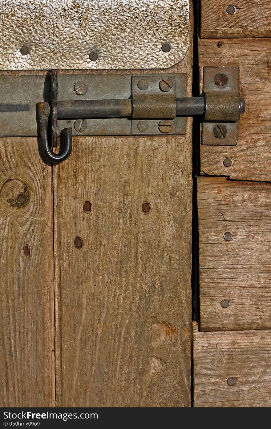 Wooden stable door detail wooden texture and metal lock