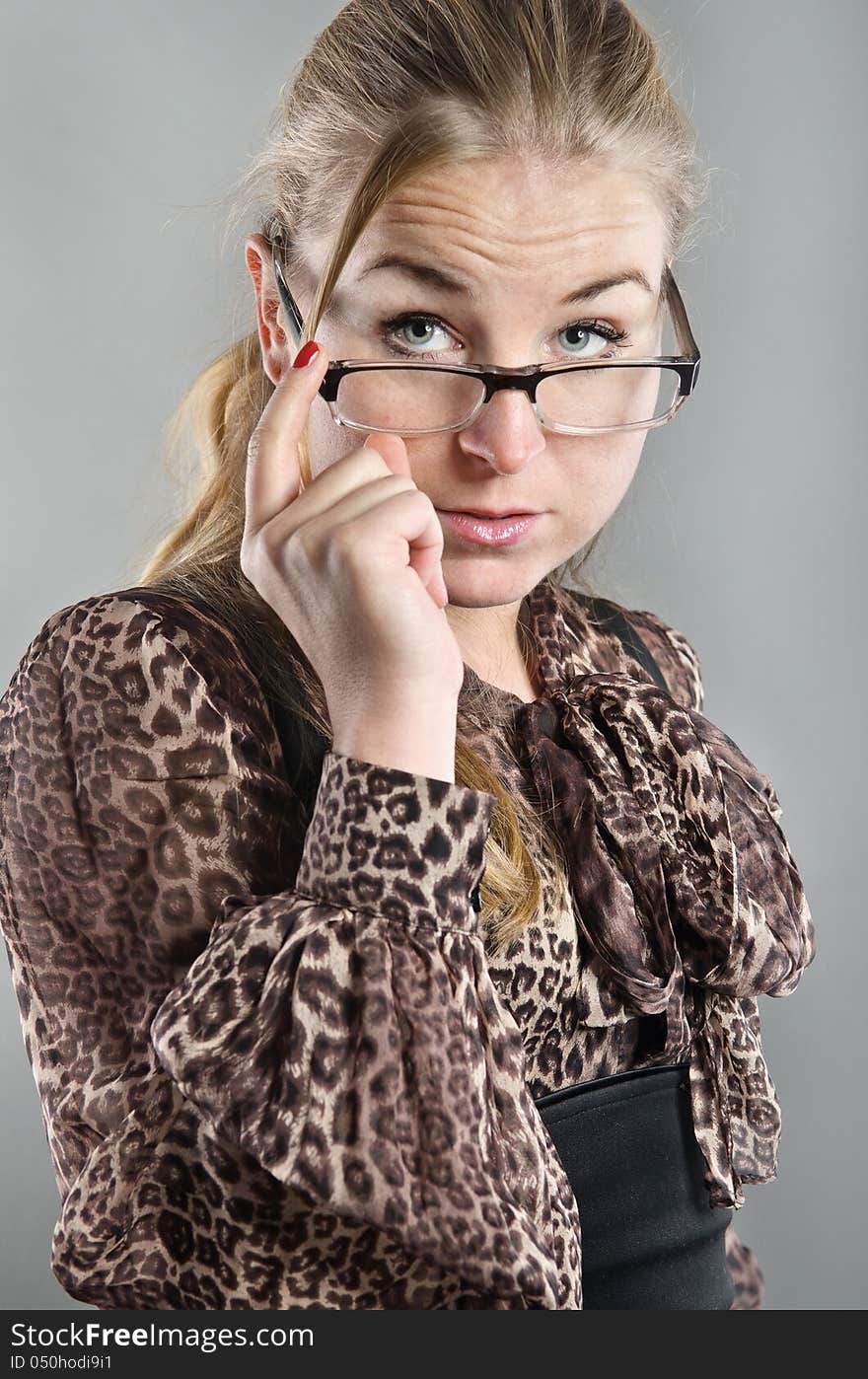 The portrait of woman. She is stern and serious like business woman. The portrait of woman. She is stern and serious like business woman.