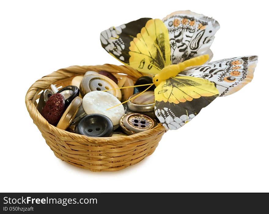 The photo shows the buttons for sewing in basket and decorative butterfly. The photo shows the buttons for sewing in basket and decorative butterfly