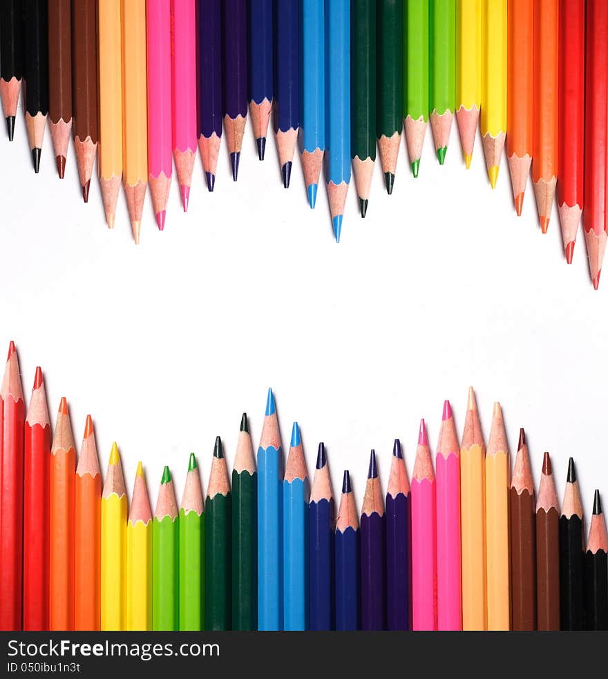 Multi Color pencils on white background