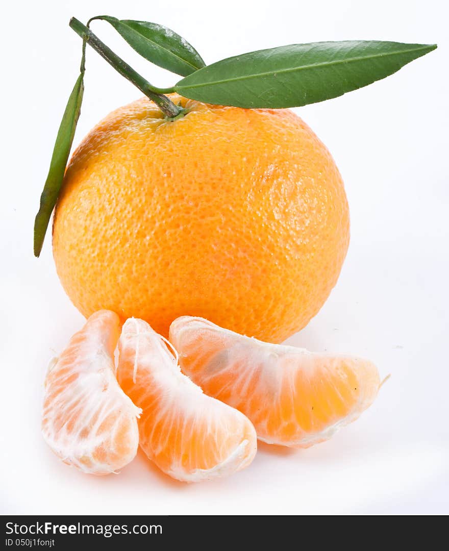 Tangerines with leaves on a white background. Tangerines with leaves on a white background.