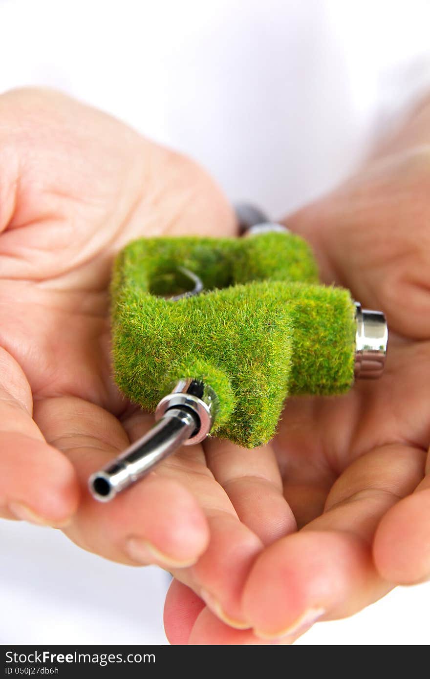 Hand holding eco fuel nozzle