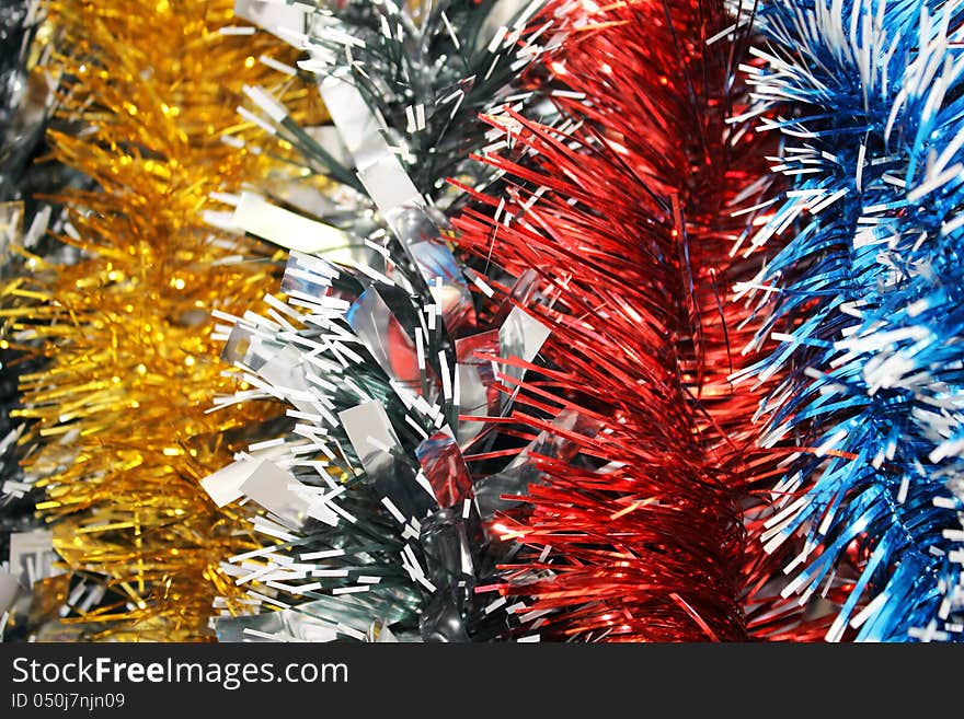 New year's tinsel (red, blue, gold). Background. New year's tinsel (red, blue, gold). Background