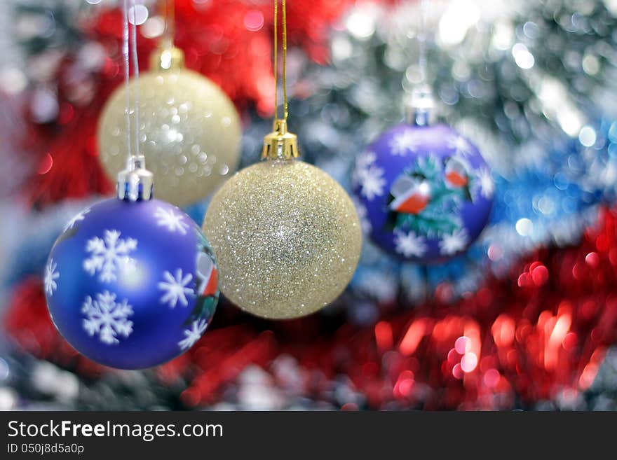 Christmas toy against the background of new year's tinsel. Christmas toy against the background of new year's tinsel