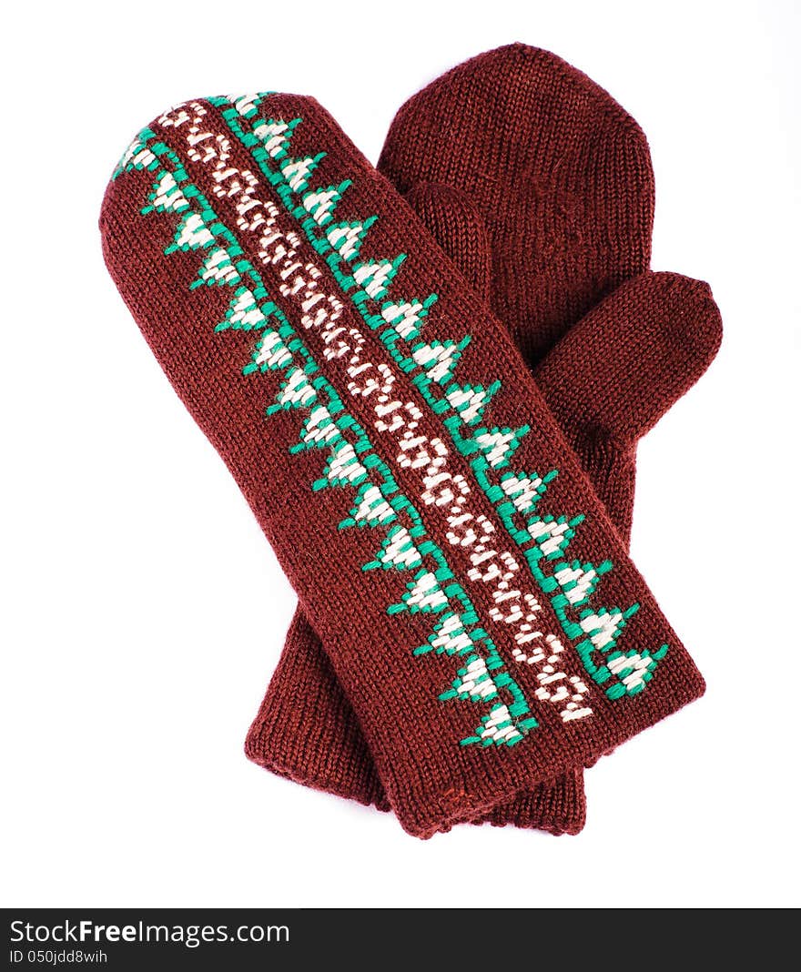 Brown woolen knitted mittens on white background. Brown woolen knitted mittens on white background