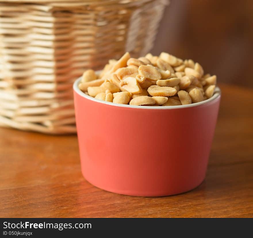 Salted nuts in red bowl