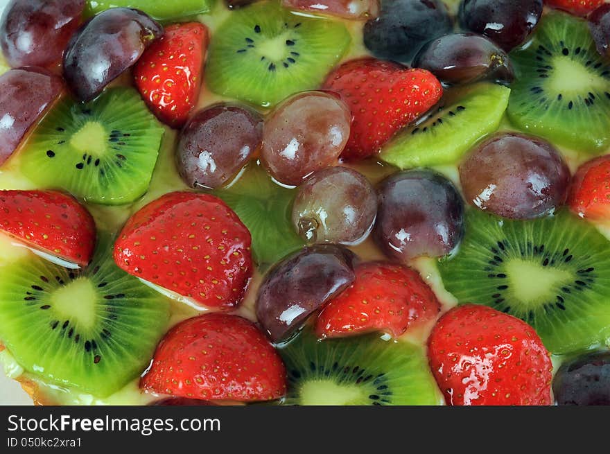 Fruit cake dessert close up, kiwis and strawberries. Fruit cake dessert close up, kiwis and strawberries