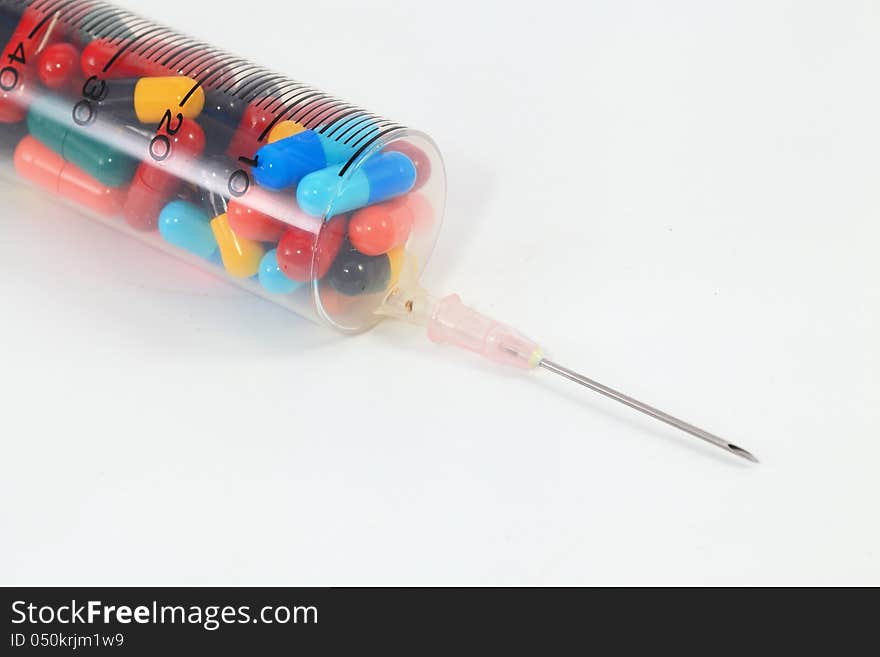 Drugs pack in syringe on white background. Drugs pack in syringe on white background