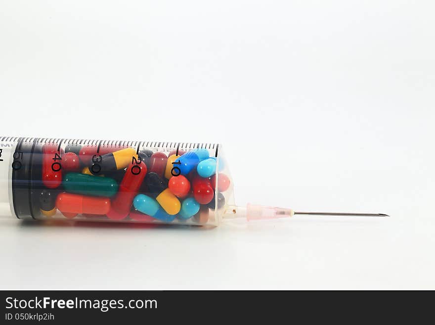 Drugs pack in syringe on white background. Drugs pack in syringe on white background