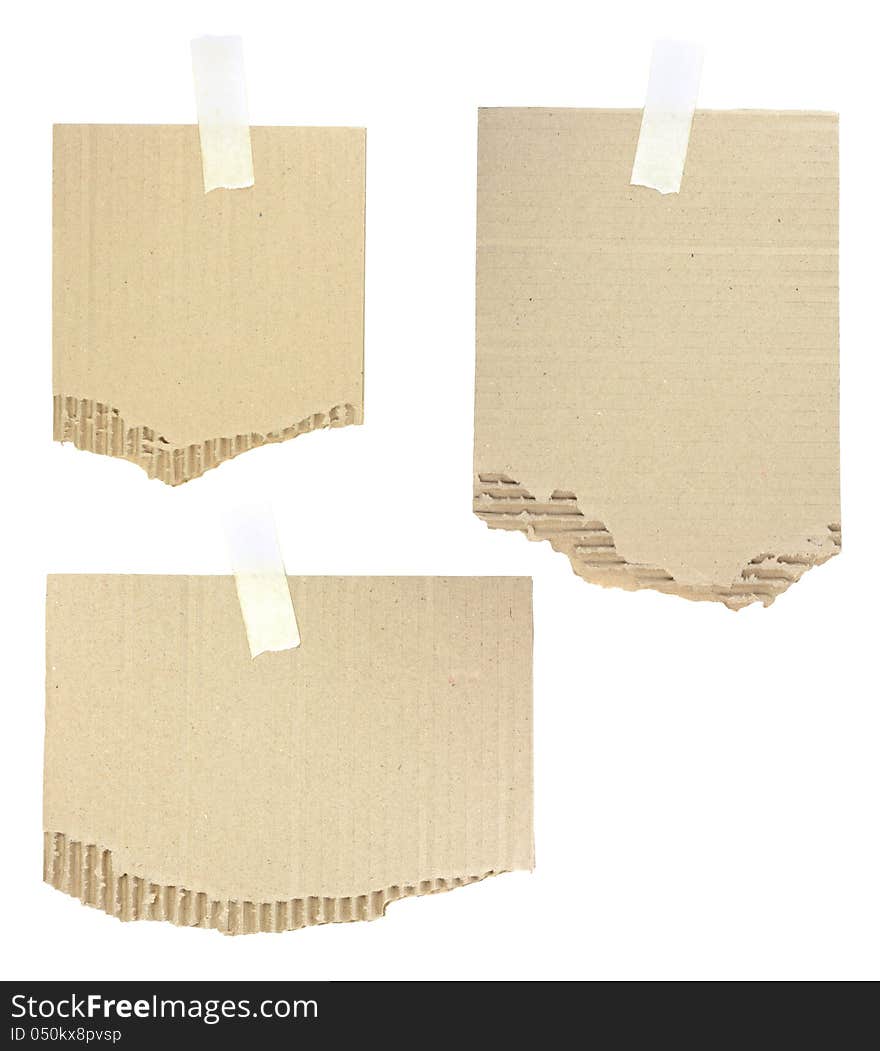 Cardboard pieces attached with a sticky tape on white background