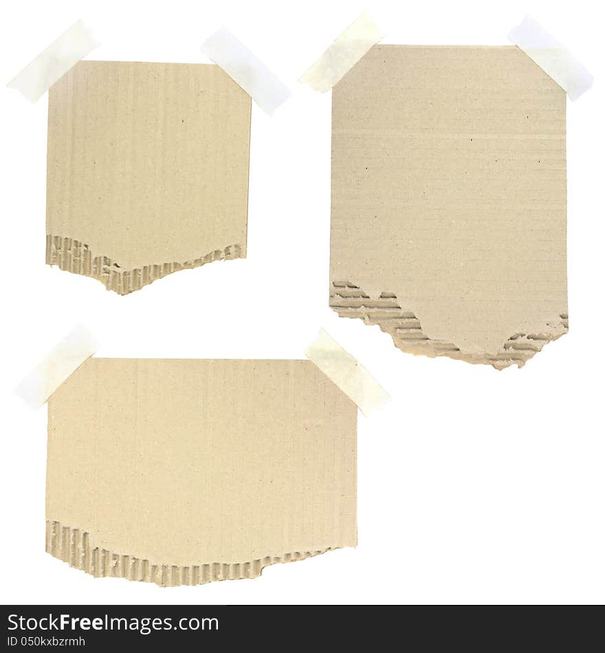 Cardboard pieces attached with a sticky tape on white background